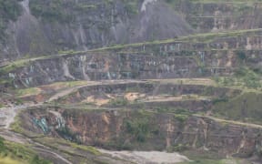Nature has gradually reclaimed the massive open pit of Bougainville Copper Limited's former lucrative mine.
