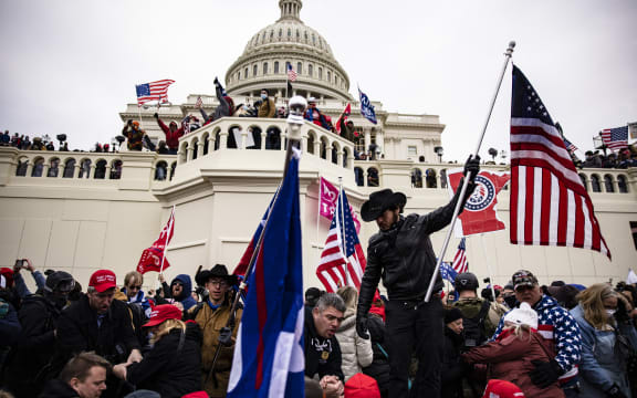 WASHINGTON, DC - JANUARY 06: Pro-Trump supporters storm the U.S. Capitol following a rally with President Donald Trump on January 6, 2021 in Washington, DC.