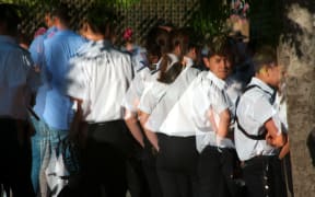 Children gathered outside school.