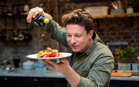 Jamie Oliver cooking at the One Kitchen Culinary School in Hamburg, Germany, in 2017.