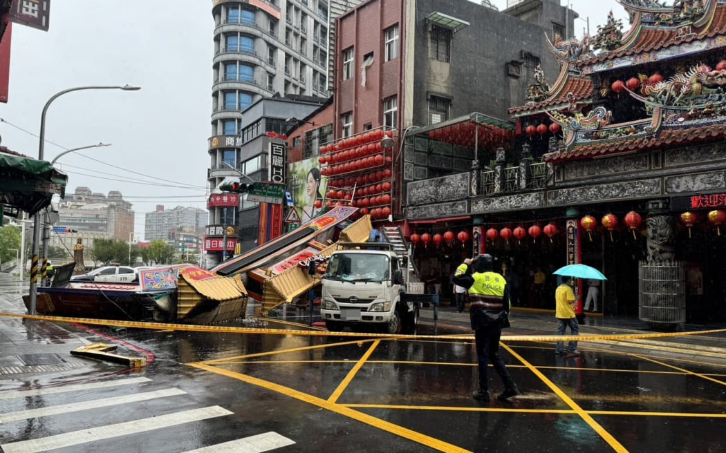 This picture provided by Taiwan’s Central News Agency (CNA) on October 31, 2024 shows Banqiao Cihui Palace archway that has collapsed in Banqiao District, in New Taipei City due to strong winds from Super Typhoon Kong-rey. - Fierce winds and torrential rain lashed Taiwan on October 31 as Super Typhoon Kong-rey neared, forcing thousands to flee from one of the most powerful storms to threaten the island in years. (Photo by CNA / AFP) / China OUT - Taiwan OUT - Macau OUT / CHINA OUT - TAIWAN OUT - MACAU OUT / HONG KONG OUT RESTRICTED TO EDITORIAL USE -- TAIWAN’S CENTRAL NEWS AGENCY (CNA)