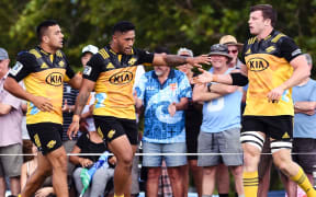 The Hurricanes celebrate a try.