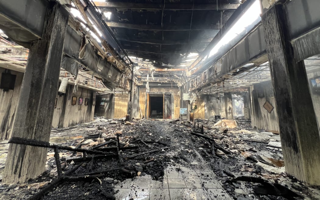 The structure at the main entrance to the parliament building was still standing but the building and its contents were decimated. Photo: Giff Johnson.
