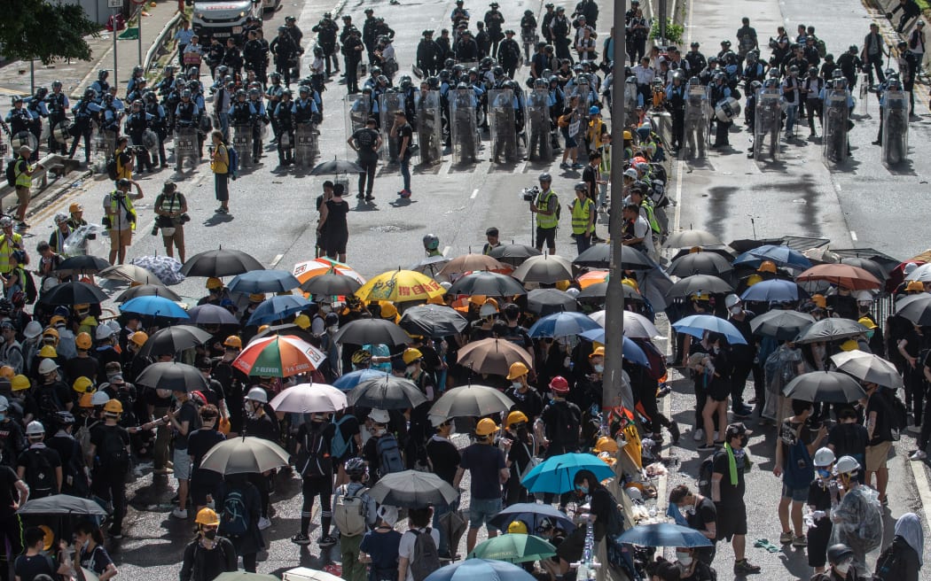 Protesters and police face-off at Harcourt Road.