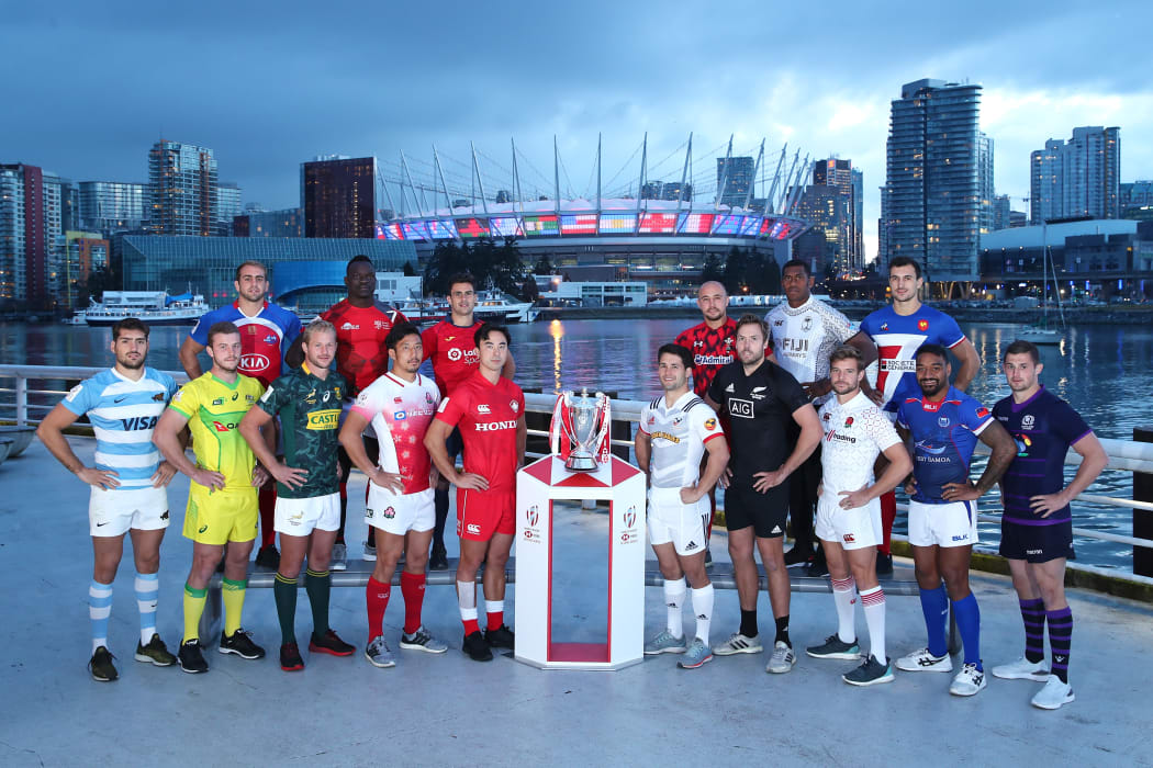 The captains pose with the trophy prior to the start of the USA Sevens.