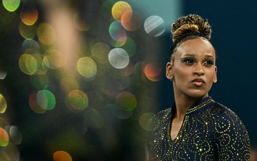 Brazil's Rebeca Andrade looks on during the artistic gymnastics women's team final during the Paris 2024 Olympic Games at the Bercy Arena in Paris, on July 30, 2024. (Photo by Loic VENANCE / AFP)