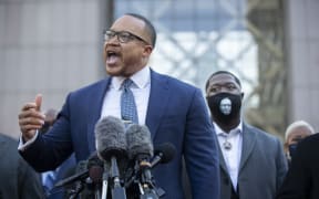 Justin Miller (left), attorney representing George Floyd's daughter, speaks during a conference in front of the Hennepin County Government Center at the start of the trial of former officer Derek Chauvin over the death of George Floyd in Minneapolis, United States on March 29, 2021.