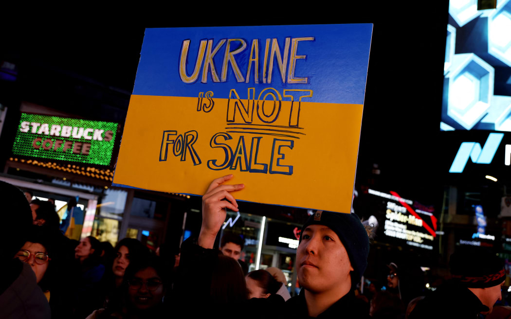 People rally in Times Square on the third anniversary of Russias Invasion of Ukraine on February, 24, 2025 in New York City. (Photo by John Lamparski/NurPhoto) (Photo by John Lamparski / NurPhoto / NurPhoto via AFP)