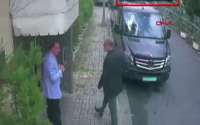 CCTV footage obtained from Turkish news agency DHA shows Saudi journalist Jamal Khashoggi (R) arriving at the Saudi Arabian consulate in Istanbul on 2 October, 2018.