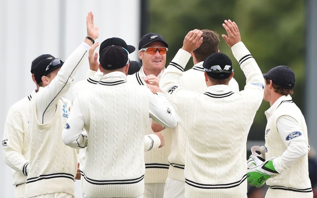 Martin Guptill and team-mates celebrate the dismissal of Chandimal during day 3 of the 1st cricket test match between New Zealand Black Caps and Sri Lanka at University Oval, Dunedin, New Zealand. Saturday 12 December 2015. Copyright photo: Andrew Cornaga / www.photosport.nz