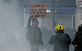 "When will there be a vaccine against police violence?" reads a French protester's placard against the draft Global Security Law.