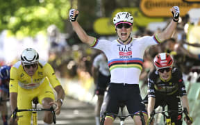 Tadej Pogacar, centre, takes the fourth stage of the Tour de France, from Mathieu van der Poel, left, in second place. July 8, 2025. (Photo by Loic VENANCE / AFP)