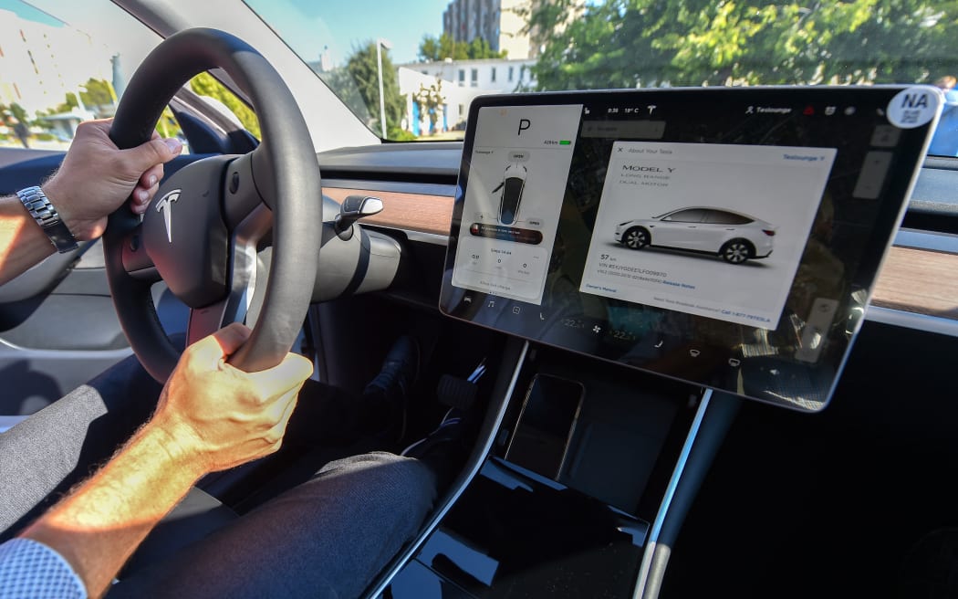 A picture taken on September 5, 2020 shows an inside view of a "Tesla Model Y" car, an all-electric compact SUV by US electric car giant Tesla, during its presentation at the Automobile Club in Budapest.