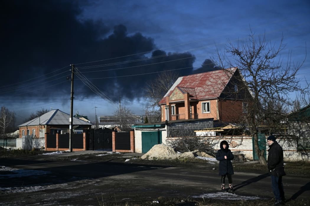 Black smoke rises from a military airport in Chuguyev near Kharkiv  on February 24, 2022.