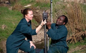 Dr Rene Corner-Thomas and PhD student Aloyce Bunyaga xing one of the cameras used in the trial.
