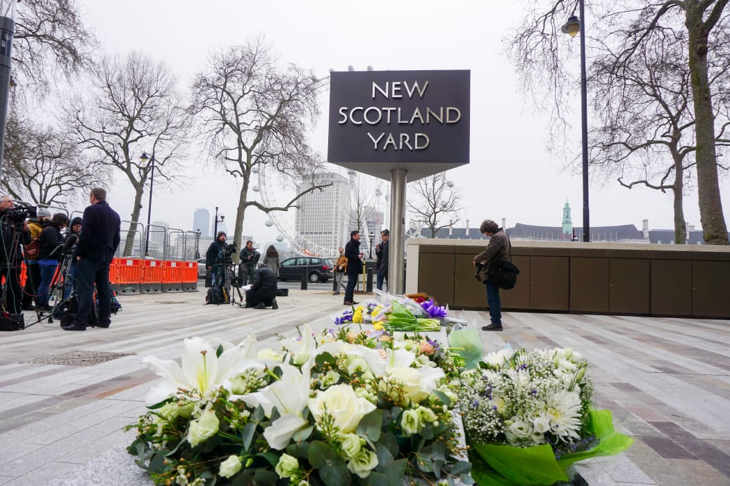 A tribute to the victims of the attack left at Scotland Yard.