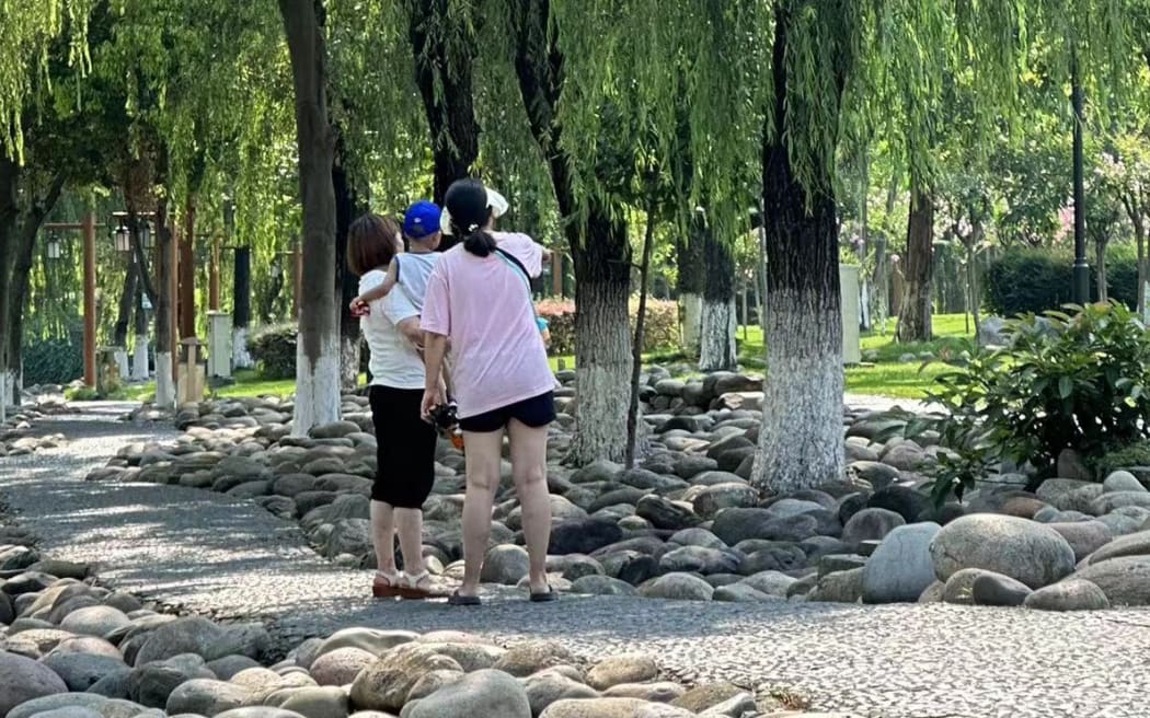 Sherry Li (right) lives in China with her daughter and mom.
