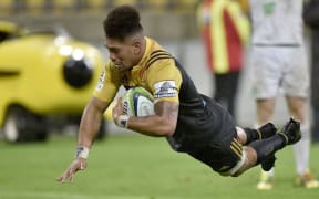 Ardie Savea scores the first of his two tries for the Hurricanes in their 27-20 win over the Highlanders.