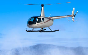 Helicopter flying. Robinson R22 file image.
