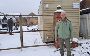 Hamilton man Yuriy Gladun inspects one of the modular homes funded by Rotary New Zealand.