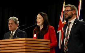 Prime Minister Jacinda Ardern - flanked by deputy PM Winston Peters and Immigration Minister Iain Lees-Galloway - announces the increase in NZ's refugee quota.