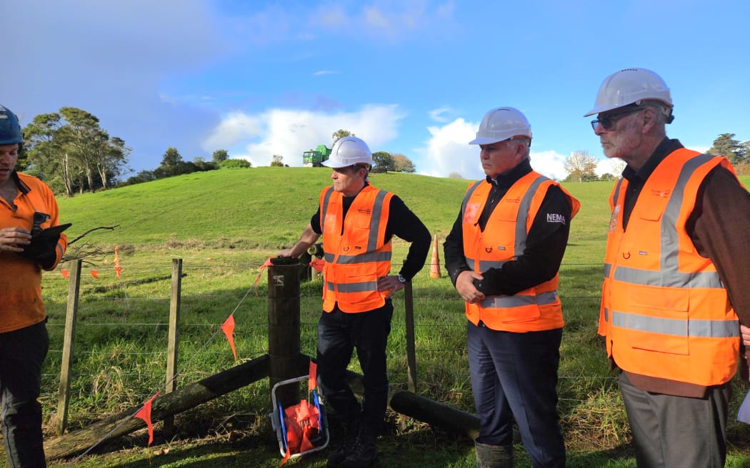 Minister for Emergency Management and Recovery Mark Mitchell (centre) announced $2 million for Auckland's clean-up from extreme weather events alongside Mayor Wayne Brown (right) at the Opanuku Stream in Henderson on 24 May, 2024.