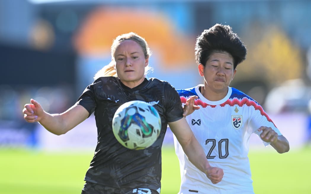 Paige Satchell of New Zealand with Orawan Keereesuwannakul of Thailand during their first international friendly in Christchurch.