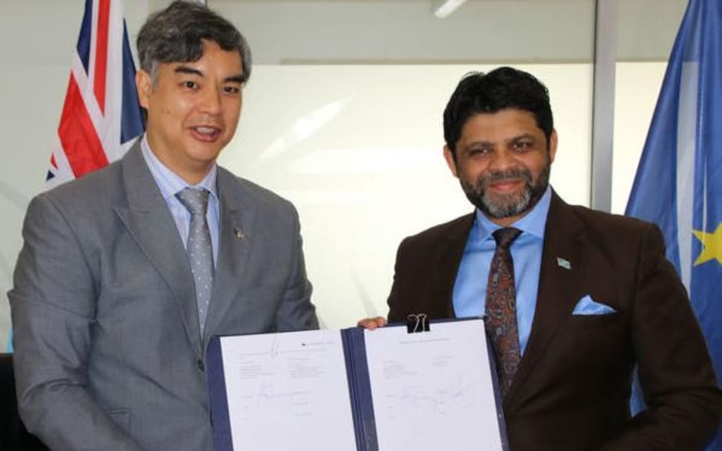 EU Ambassador to the Pacific, Sujiro Seam, left and Fiji's Minister for Economy, Aiyaz Saiyed-Khaiyum.