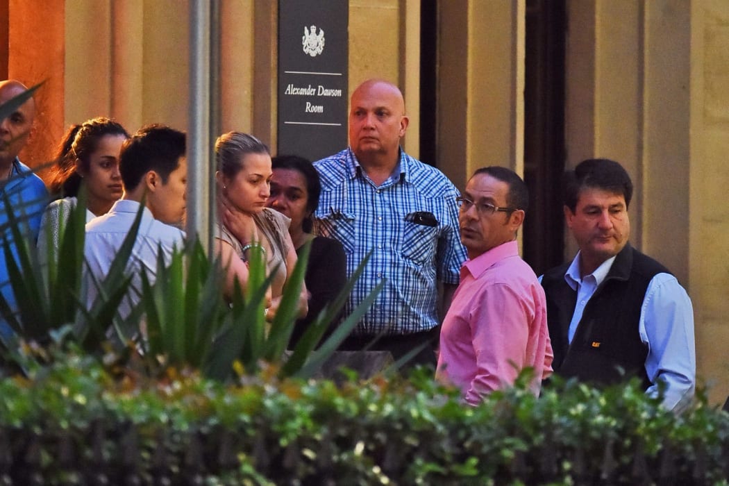 Relatives of the hostages from the siege at the Lindt chocolate cafe in Martin Place gather in Sydney.