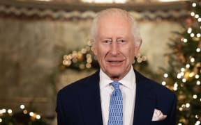 Britain's King Charles III smiles during the recording of his Christmas message at the Fitzrovia Chapel in central London on December 11, 2024. - This year marks the first time the Sovereign's Christmas message has been filmed outside a Royal residence since 2006, when it was filmed at Southwark Cathedral. (Photo by Aaron Chown / POOL / AFP)