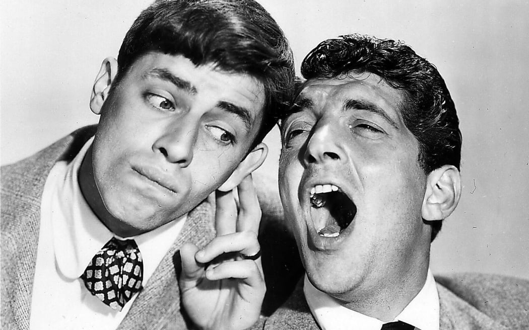 US actor Jerry Lewis (L) listening to his long time acting partner Dean Martin in the 1950s.
