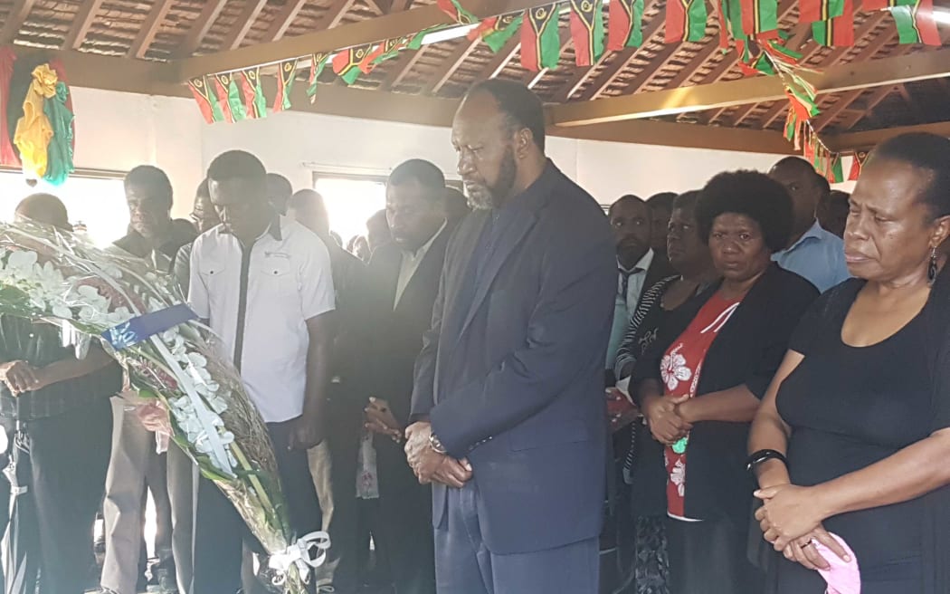 Vanuatu's prime minister Charlot Salwai and staff from his office pay their last respects to President Baldwin Lonsdale in Port Vila on 19 June 2017.