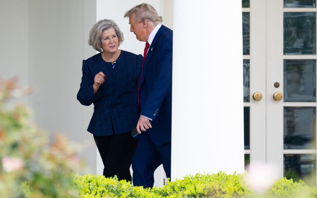 US President Donald Trump speaks with White House Chief of Staff Susie Wiles before departing the White House in Washington, DC, on June 20, 2025, en route to his club in New Jersey. (Photo by SAUL LOEB / AFP)