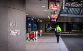 (File photo) A security guard outside the departures area of the Sydney International Airport in Sydney, 29 September 2020.