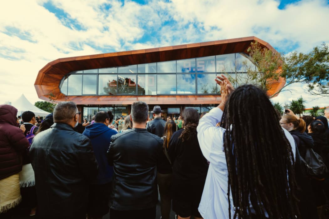 An image of the exterior of Te Oro Glen Innes Music and Arts Centre on opening day with excited crowds in front.