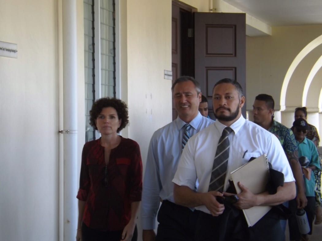 Police Commissioner, Fuiavailili Egon Keil, in the middle heading to court with his lawyer (right) a family supporter and civilian police officers behind.