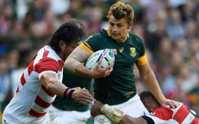 Patrick Lambie is tackled in South Africa's World Cup loss to Japan.