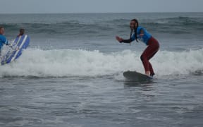Otorohanga College student Tasmin White enjoyed the surfing experience at Fitzroy beach.