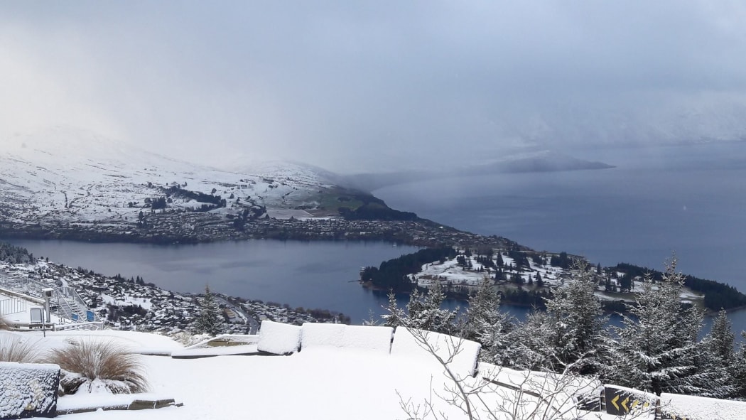 A view of Queenstown from the Queenstown Skyline, covered in snow on Wednesday morning.