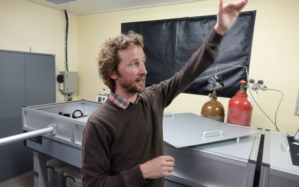 Dr Richard Querel, NIWA Atmospheric Scientist discussing some Lauder equipment