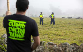 Protester and police at Ihumatao.