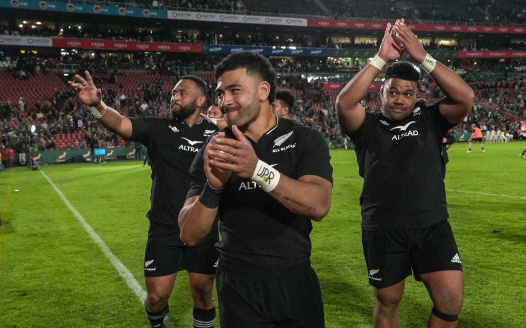 Richie Mo’unga and fellow All Blacks after their win over the Springboks at Ellis Park, 2022.