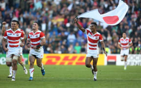 The Japan team celebrate the shock win over South Africa, September 19, 2015.