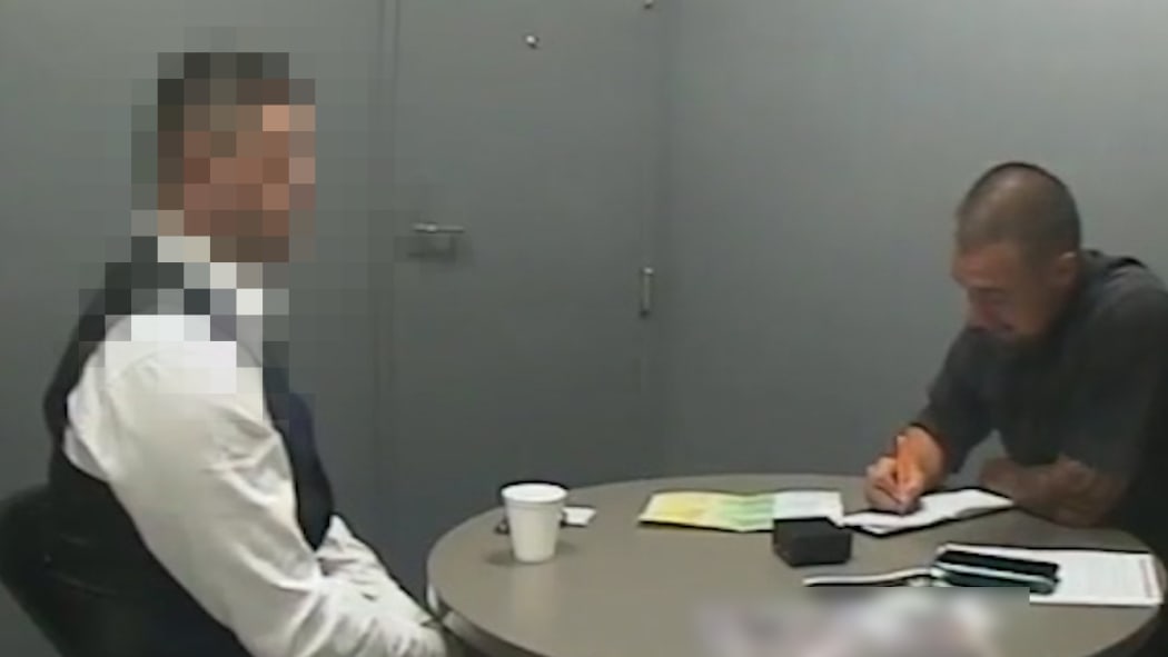 An image taken from video shown to the jury of defendant being interviewed by a police officer at Auckland Central Police Station on 6 December.