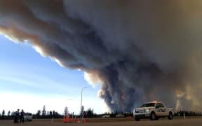 The ferocious wildfire wreaking havoc in Canada has doubled in size.