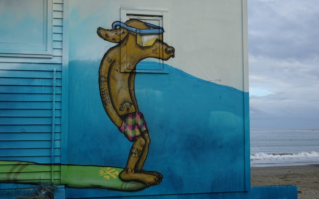 Art on the walls of Lyall Bay Surf and Life Saving Club will be sold off after the demolition.