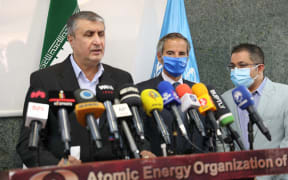 Head of the AEOI Mohammad Eslami delivers a speech next to director general of the International Atomic Energy Agency (IAEA) Rafael Grossi.