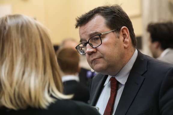 Labour MP Grant Robertson, Minister of Finance listens to media questions