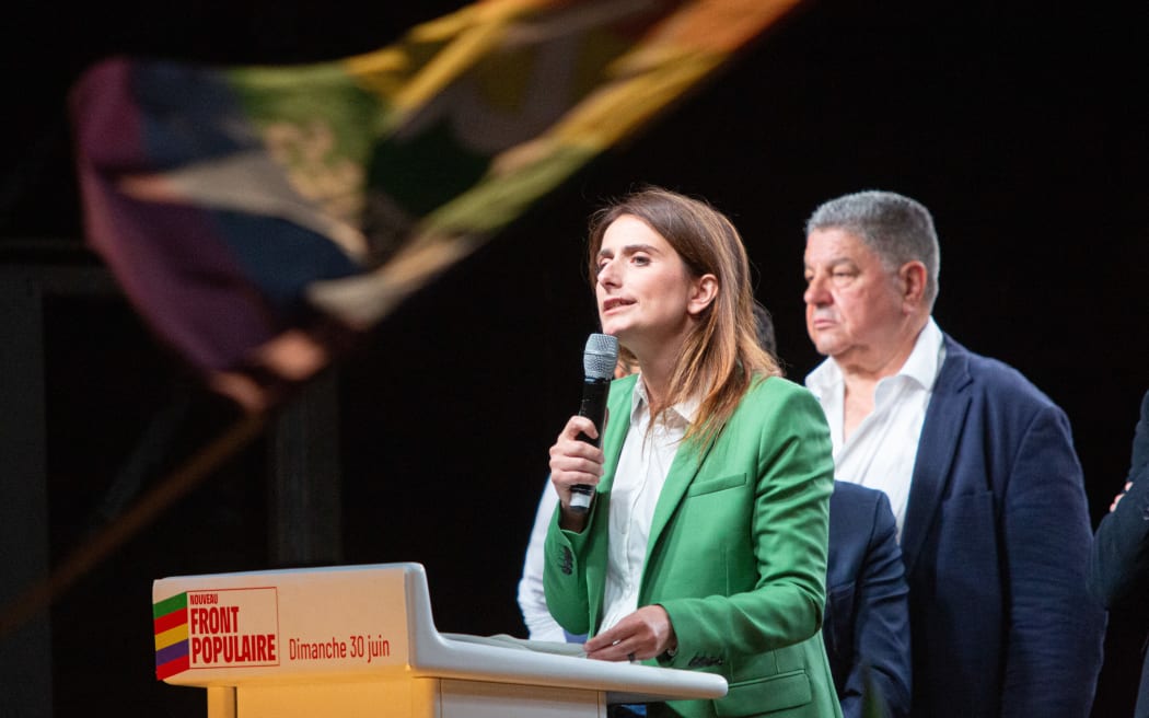 Marine Tondelier, National Secretary of the Ecologists party, Europe Ecologie Les Verts (EELV) gives a speech during the rally against the far-right wing after the results of the early French elections on the Place de la Republique in Paris, France on June 30, 2024, Thousands of people gathered on Sunday evening at the Place de la Republique in Paris in support of the Nouveau Front Populaire (New Popular Front - NFP) following the extreme right s historic electoral score. (Photo by Victoria Valdivia / Hans Lucas / Hans Lucas via AFP)
