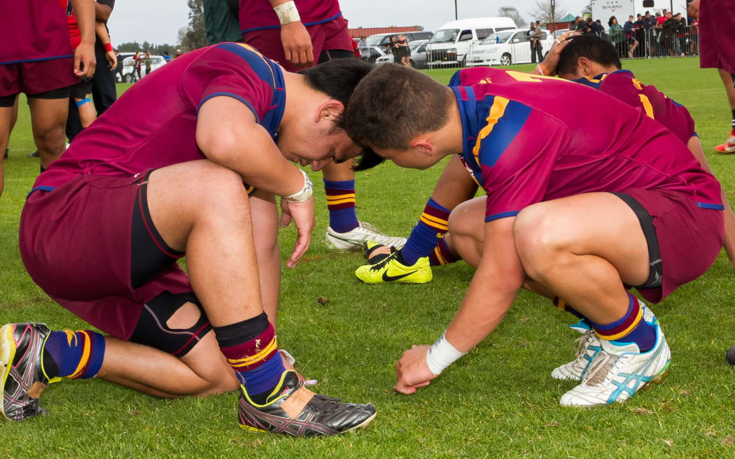 Dejected St Paul players after Kelston Boys High School v St Paul's College, Final - National Secondary Schools Rugby League Tournament. Auckland, September 2014.
